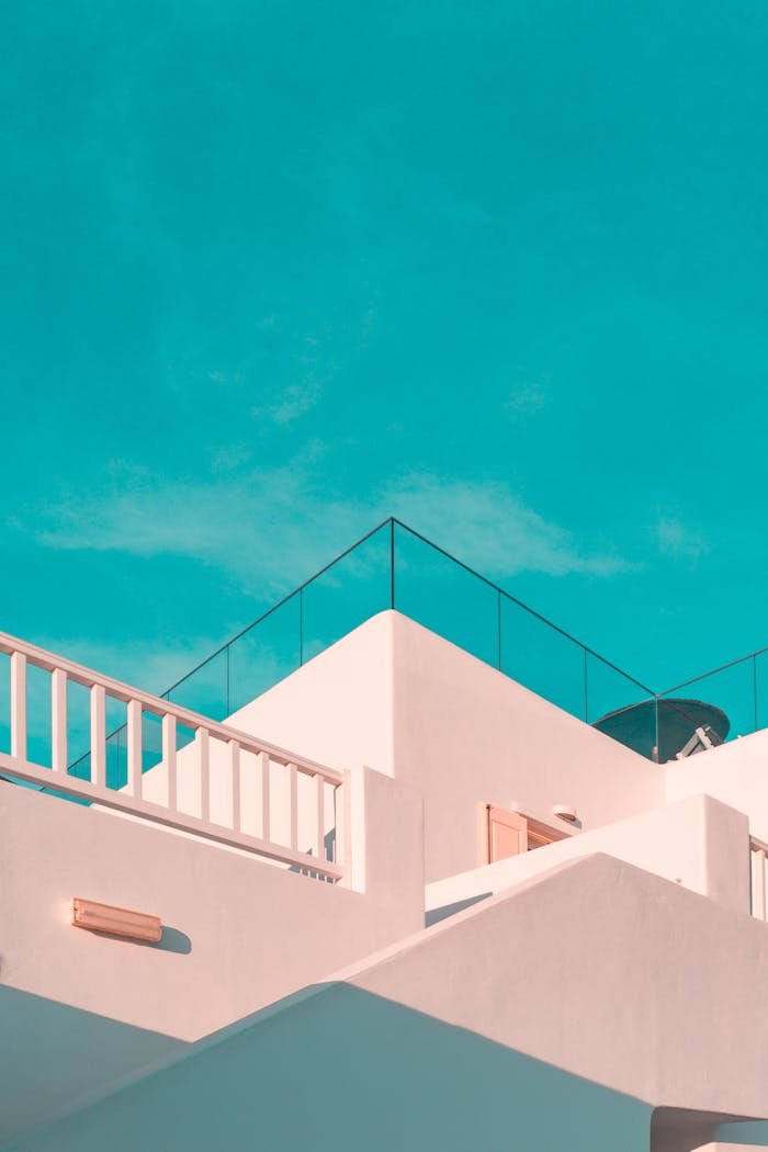 gallery-4 Explore the clean lines of modern Cycladic architecture under a clear blue sky in Platis Gialos, Greece.