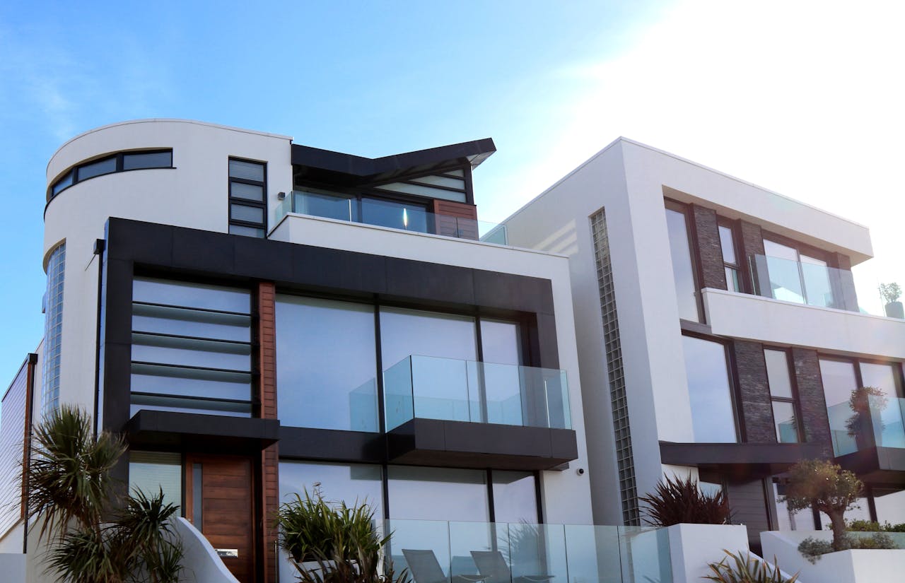 gallery-1 Contemporary luxury home with glass balconies in Poole, UK, showcasing modern architectural design.