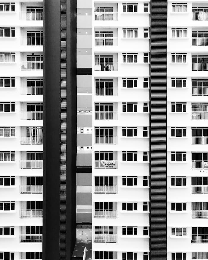 contact-img Stunning black and white photo of modern high-rise in Shah Alam, Malaysia.